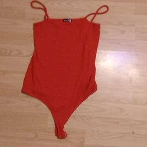 Women's red sleeveless bodysuit. Popular brand. Size XL